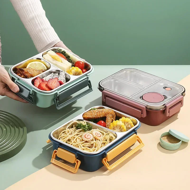 Lunch box isotherme en acier inoxydable avec trois compartiments, couvercle étanche et poignées solides, idéale pour transporter un repas complet chaud ou froid au travail, à l’école ou en pique-nique.