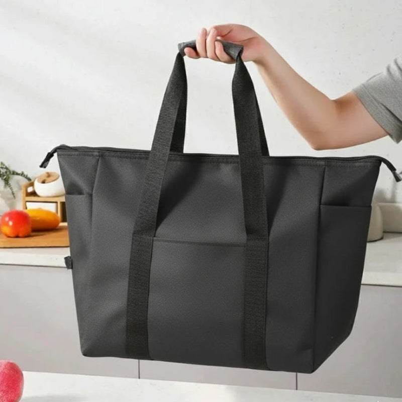 Grand sac isotherme noir porter par une personne