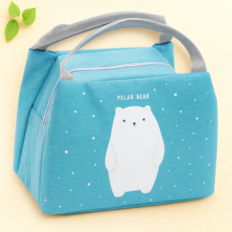 Sac isotherme bebe bleu avec ourson de face sur fond beige