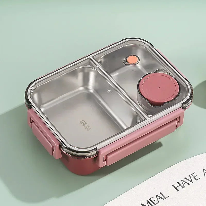 Lunch box isotherme en acier inoxydable rouge avec deux compartiments et un petit pot hermétique intégré, idéale pour emporter un repas équilibré au bureau, à l’école ou en déplacement, tout en gardant les aliments séparés et à bonne température.