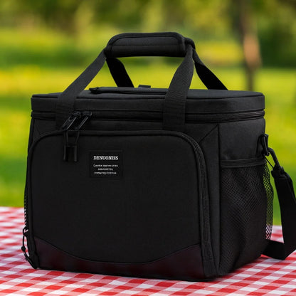 Sac isotherme 13l noir poser sur une nape de pique-nique