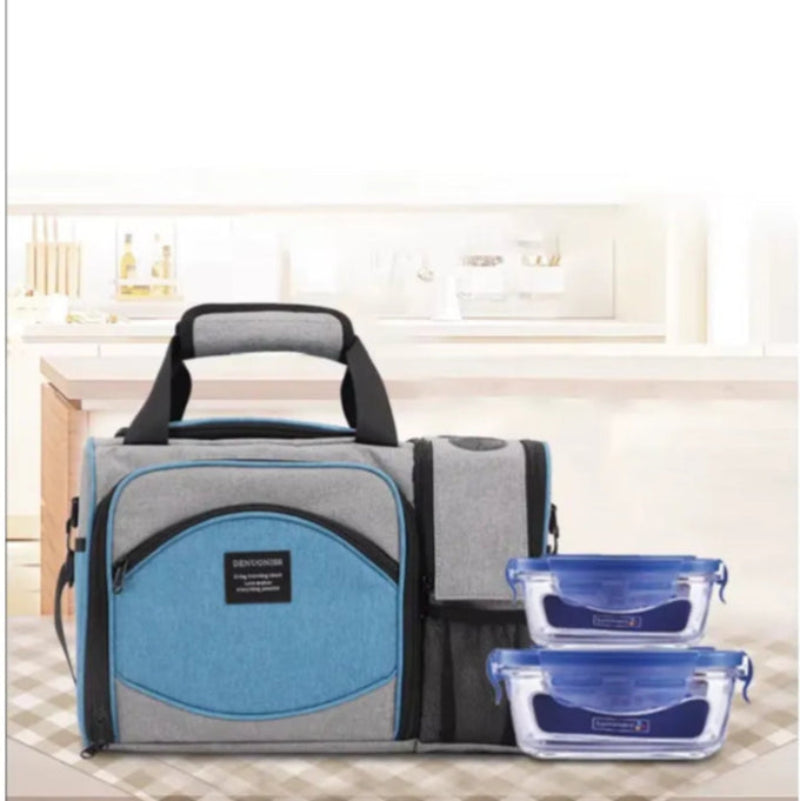Sac isotherme 25L gris et bleu uni posé en cuisine avec deux boîtes repas en verre.