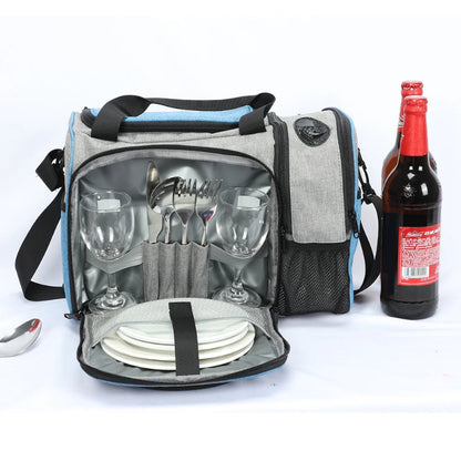 Sac isotherme 25L gris et bleu uni ouvert avec compartiment pique-nique contenant assiettes, couverts et verres