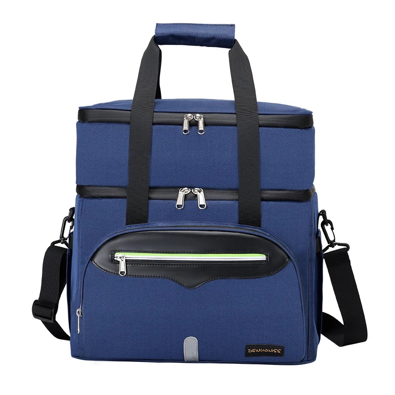 Grand sac isotherme bleu vu de face, avec poches zippées et bandoulière réglable.