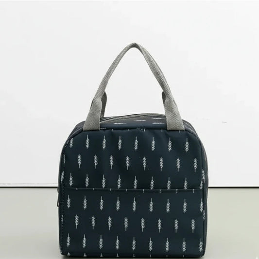 Sac isotherme repas bleu marine vu de face, décoré de motifs blancs en forme de plume.