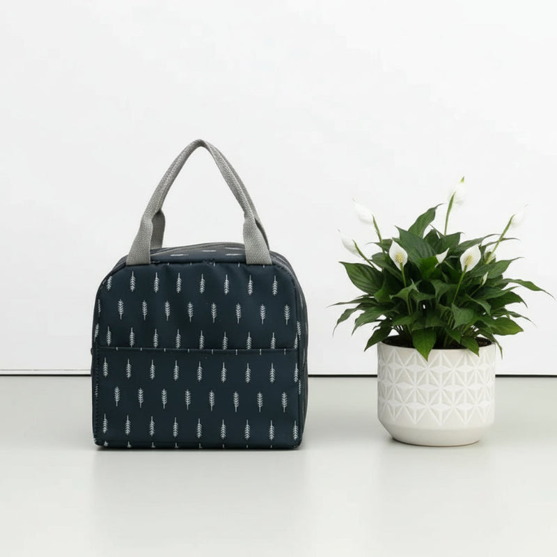 Sac isotherme repas bleu marine vu de face, décoré de motifs blancs en forme de plume.