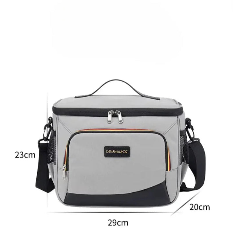 Sac isotherme repas gris avec indication des dimensions 29 cm de large, 23 cm de haut et 20 cm de profondeur.