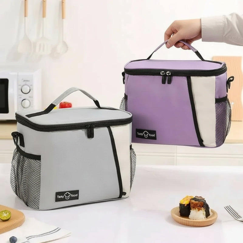 Deux sacs lunch isothermes 9L, modèles lavande et gris, présentés en cuisine pour transporter un repas ou une lunch box.